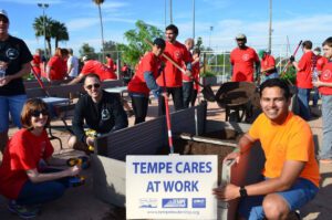 Volunteers gardening at Tempe Cares event.